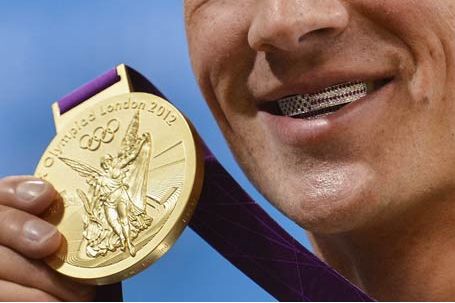 US Swimmer Ryan Lochte smiles over the top with a Paul Wall-inspired grill