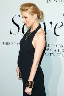 Actress Sienna Miller shows off her baby bump on the red carpet in NYC