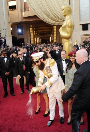 Sacha Baron Cohen stunts at 2012 Oscars dressed up like \'The Dictator\' biography